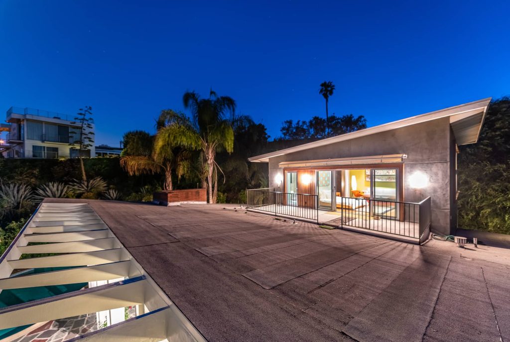 , this home sits hidden above the street and offers panoramic views from the Hollywood sign to the Griffith Park Observatory and beyond