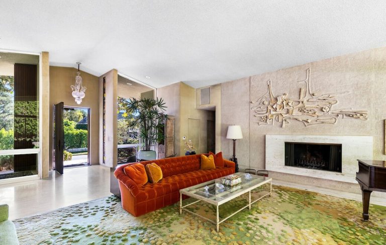 Original rugs, wall coverings and sculptures are ever present while perusing thru this home.