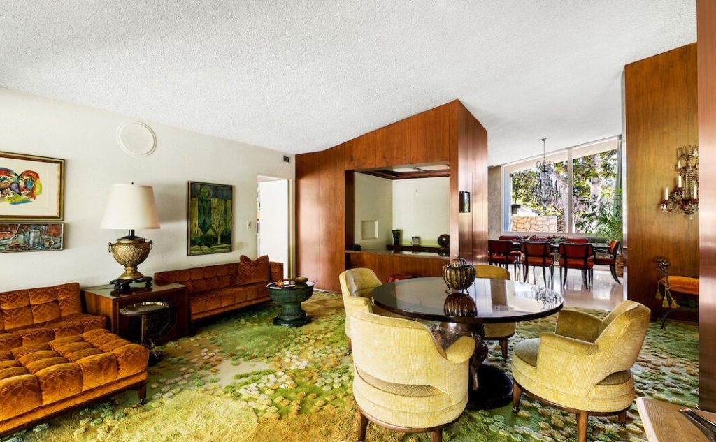Original rugs, wall coverings and sculptures are ever present while perusing thru this home.