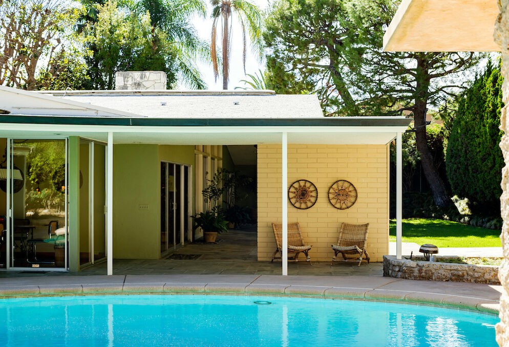 Beverly Hills Brilliant Mid Century Architectural presents an incredible round sparkling pool yard.