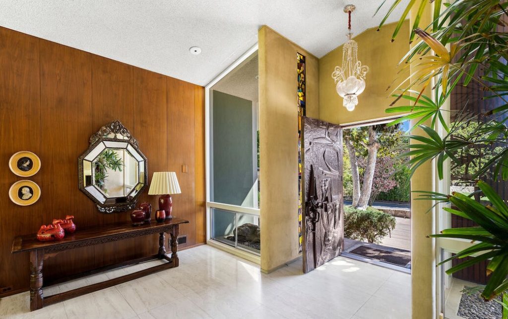 Original rugs, wall coverings and sculptures are ever present while perusing thru this home.