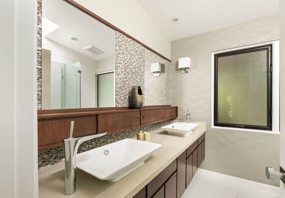 The spacious primary suite has dual closets, heated bathroom floors and enviable bathtub views! 