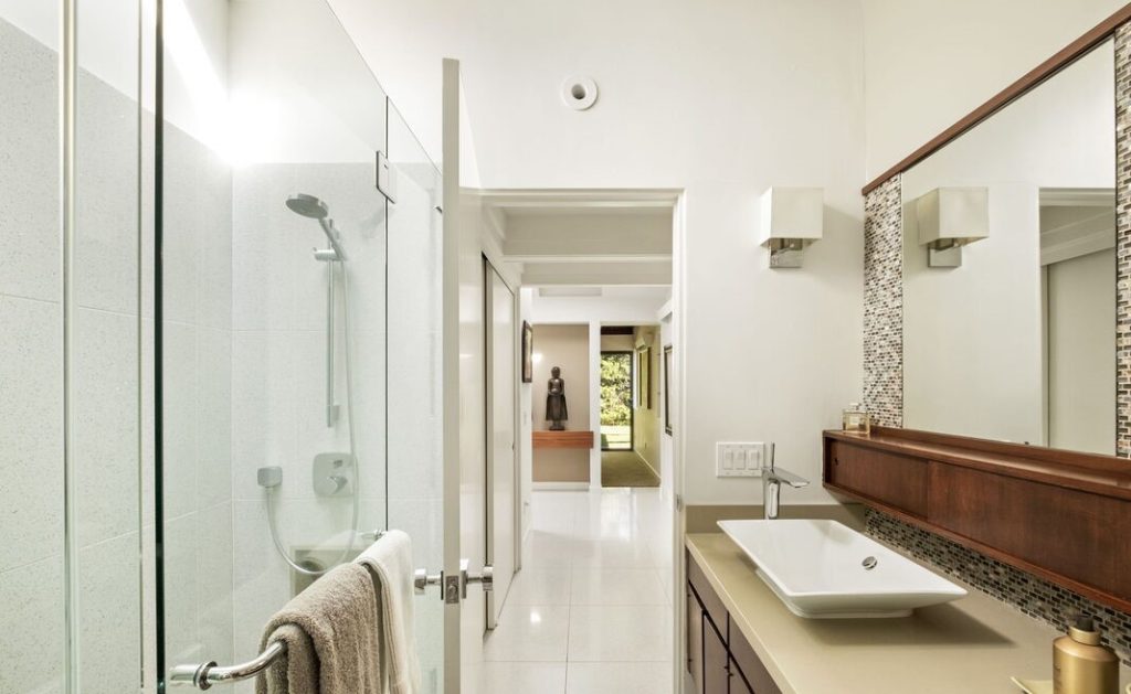 The spacious primary suite has dual closets, heated bathroom floors and enviable bathtub views! 