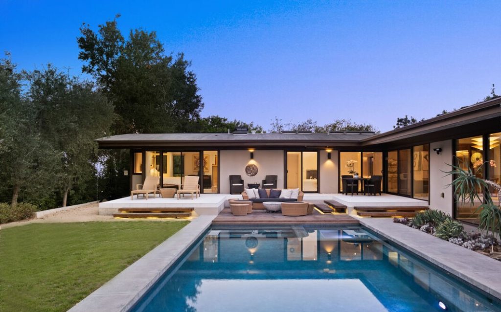 Walls of glass looking out to your refreshing saltwater pool.