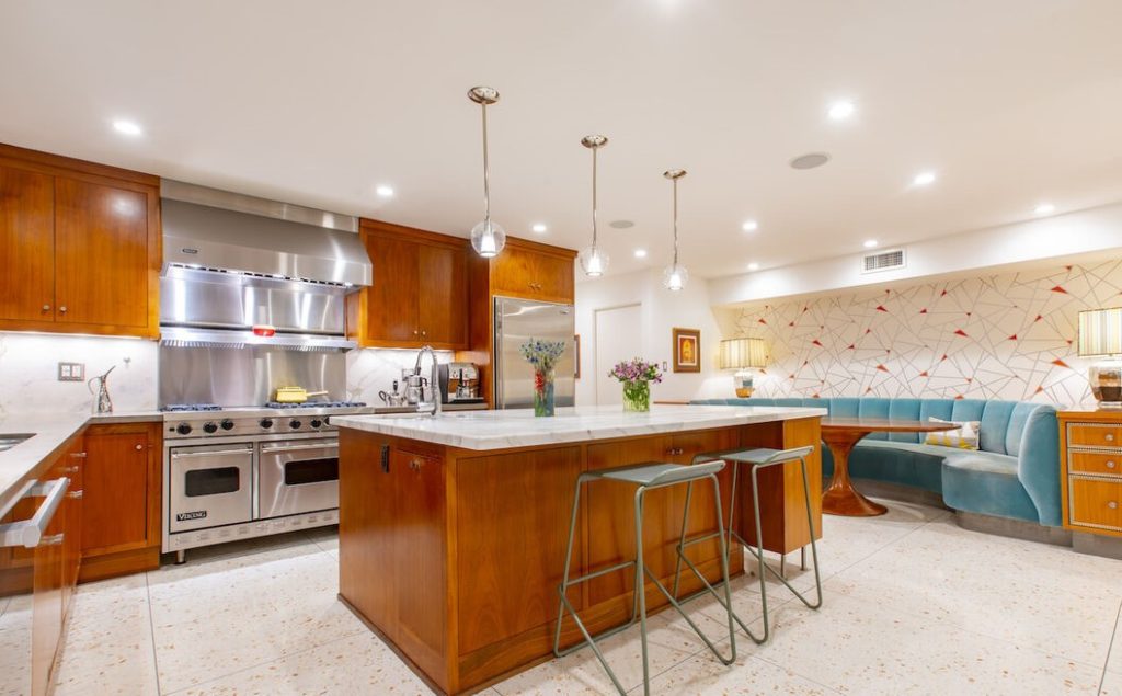 It has a true chef's kitchen with a huge center island, high end appliances and inviting built-in banquette.