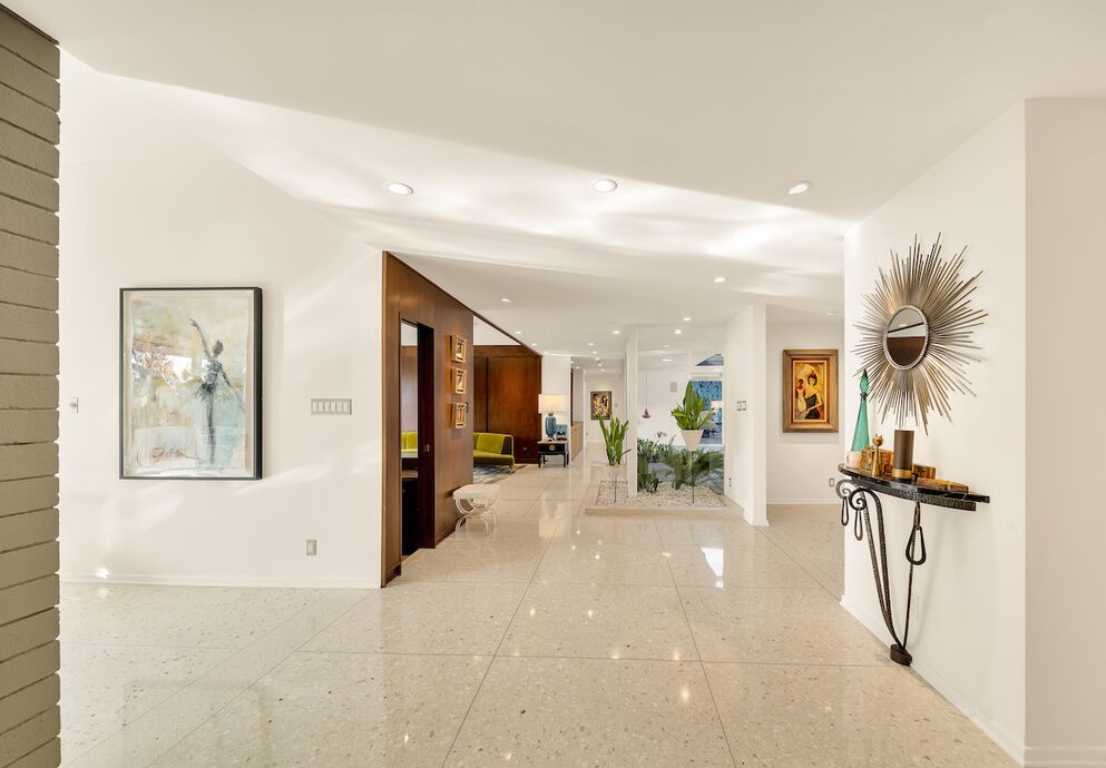 Trousdale Estates Mid-Century Modern home with walls of glass and terrazzo floors.