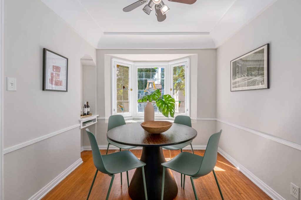 To your left is a large formal dining room and swinging door leading to the fabulous breakfast nook and kitchen areas.