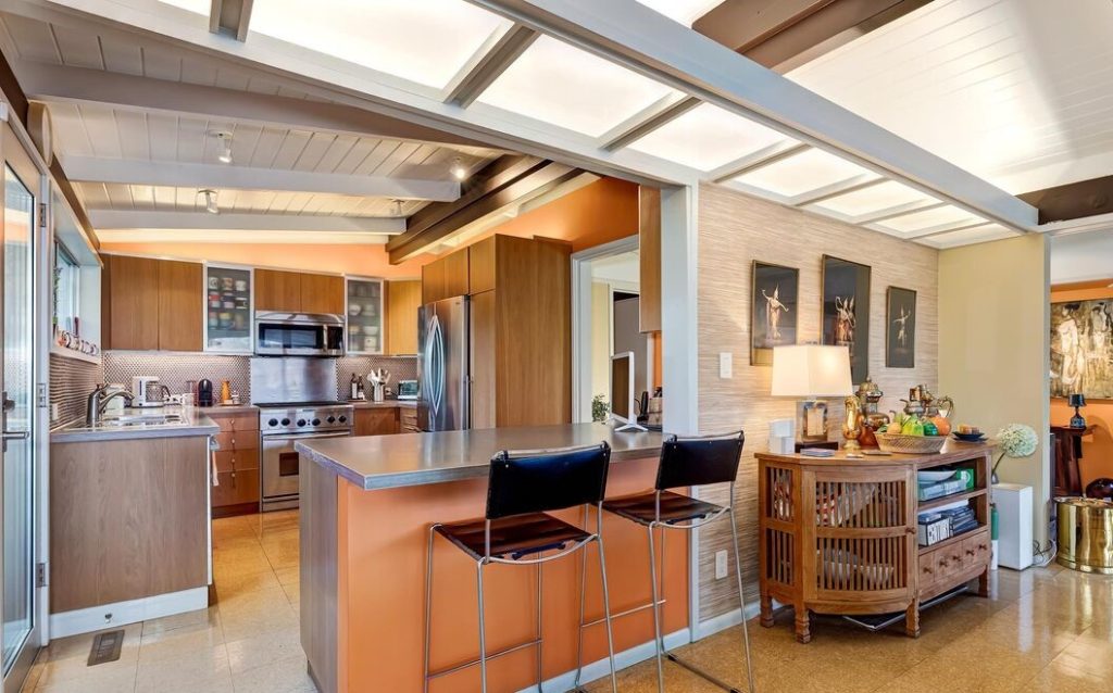 Dramatic chef's kitchen with all of the mid century touches of home