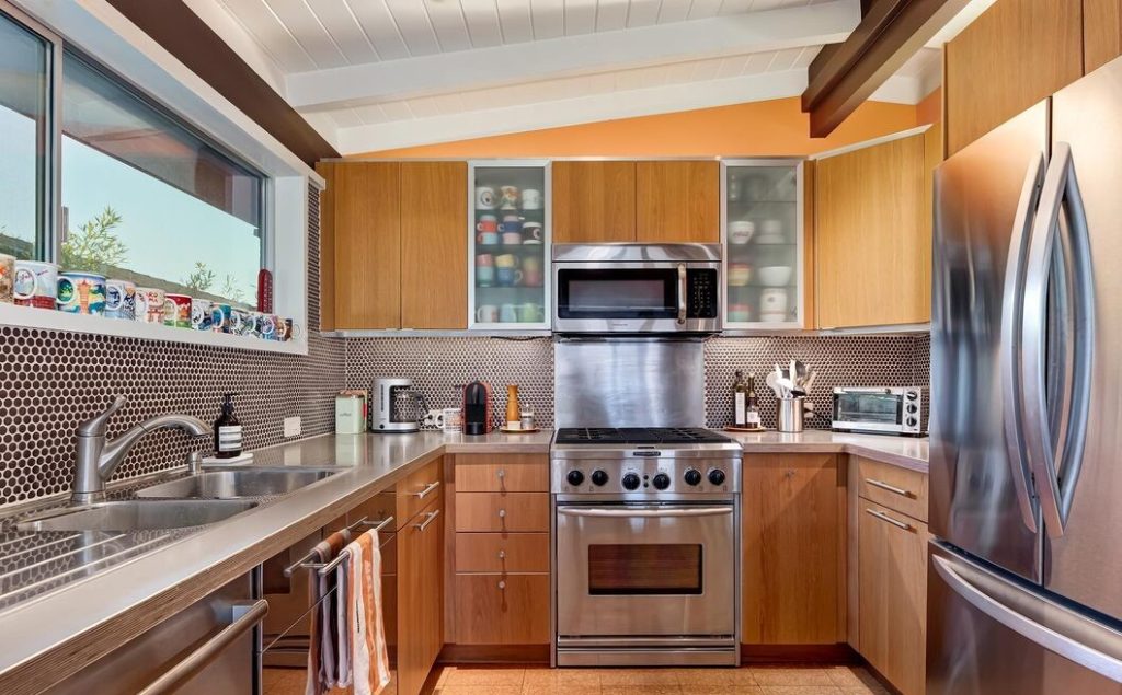 Dramatic chef's kitchen with all of the mid century touches of home