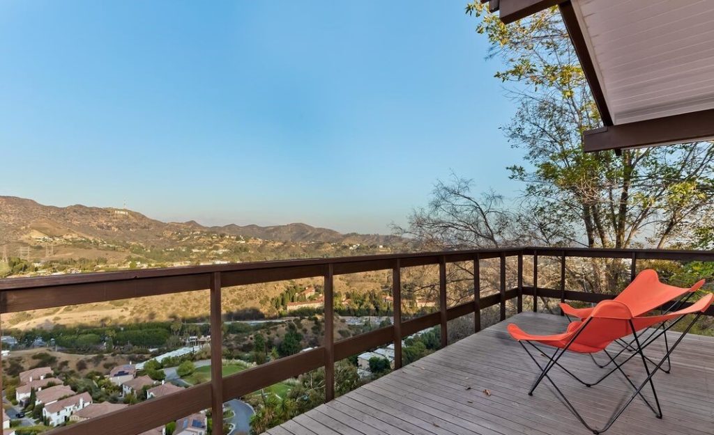 Breathtaking canyon views from this Hollywood Hills 60’s Mid Mod Post and Beam Designed in 1963 by Carli & Spak