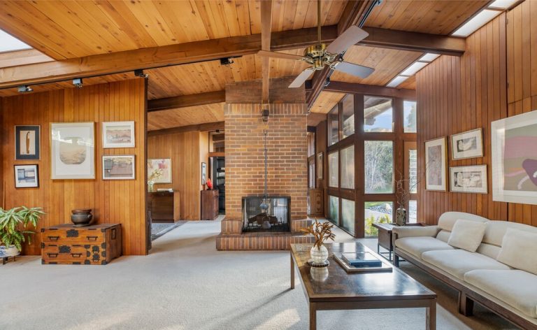 The vaulted ceilings and gorgeous wood used throughout the home are highlighted by the natural light that floods in from the expansive floor to ceiling windows and skylights.