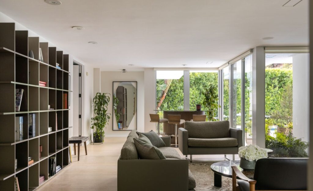 Remarkable open walls of glass enhance the mid century designed living areas