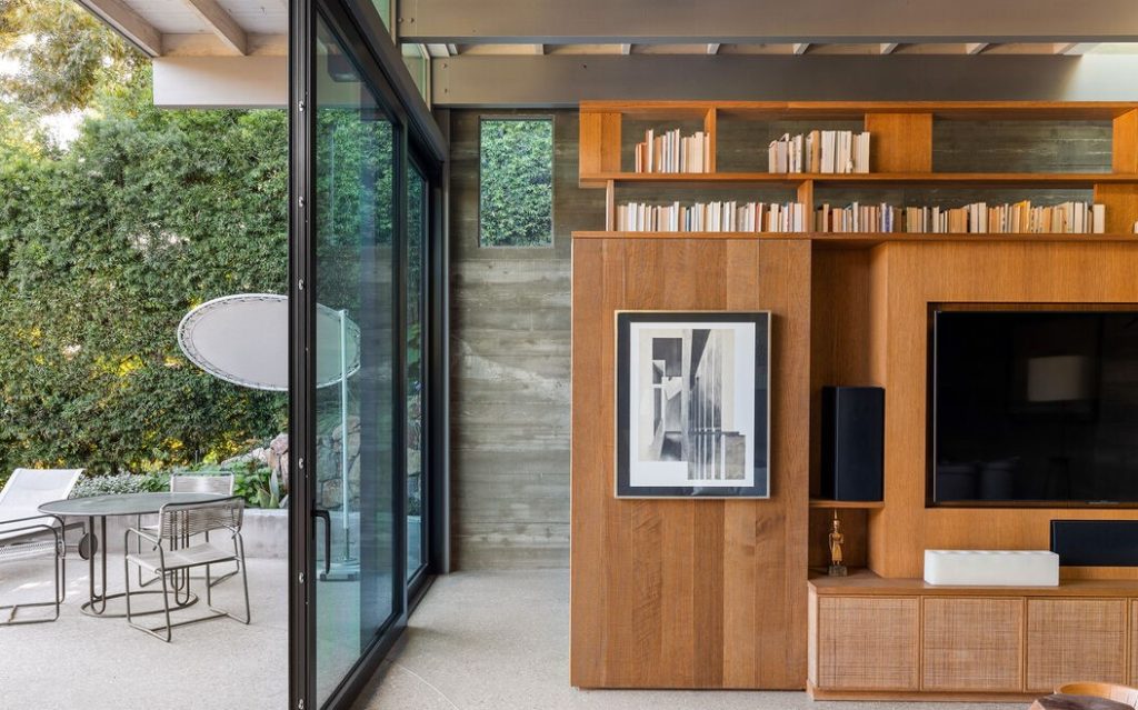 The impressive public spaces are delineated by the board-formed indoor/outdoor concrete walls, built-in oak cabinetry throughout, and radiant heated floors.