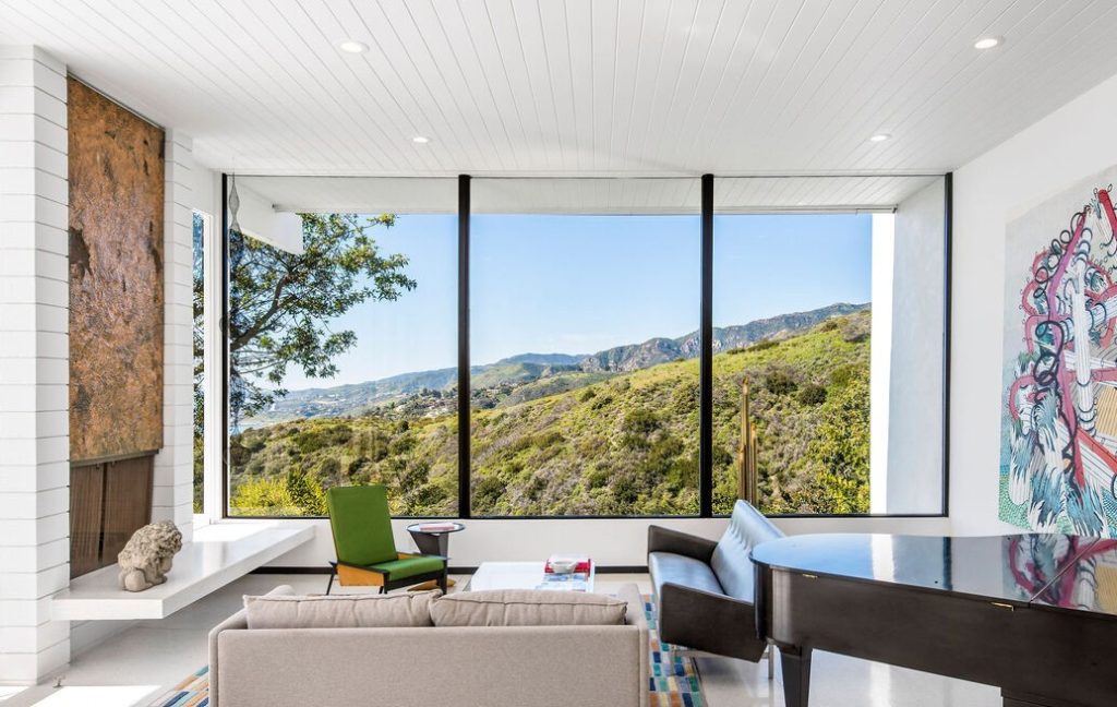 Flooded with natural light, the open flooplan and floor-to-ceiling windows showcase the magnificent panoramic views from nearly every room.