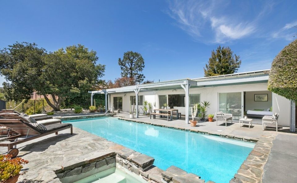 Mid-Century cul-de-sac home with pool and incredible ocean, city, and canyon views