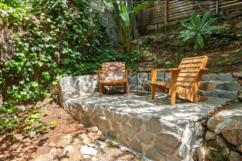 This outdoor space is exceptional for a quiet morning coffee under the canopy of mature trees or for larger gatherings of friends while looking out over the vibrant lights of the Hollywood skyline at night.