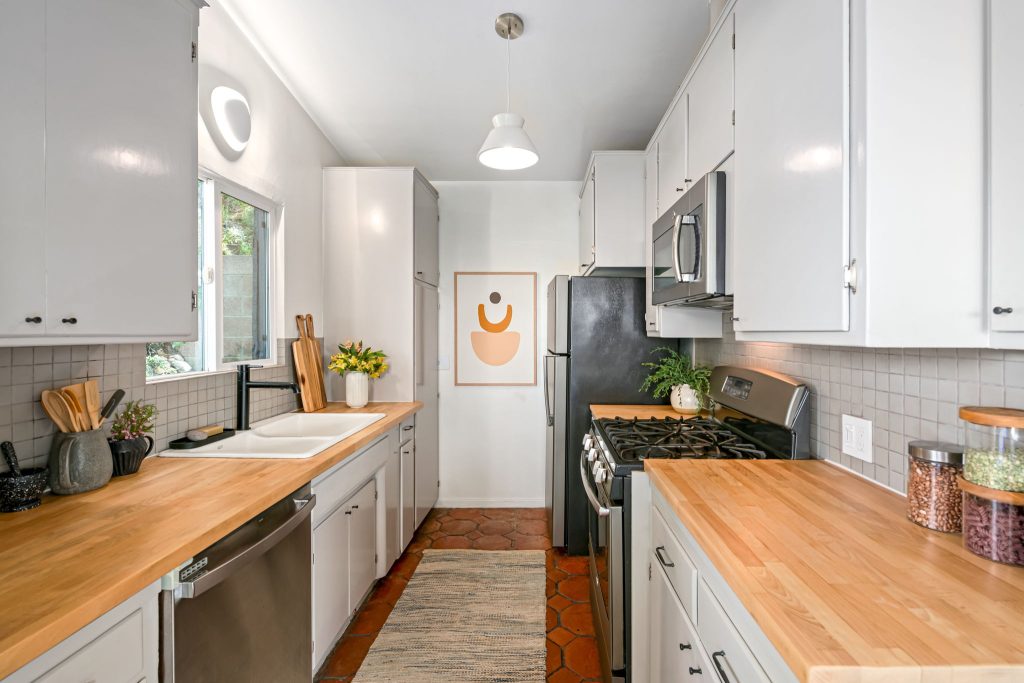 2 bedrooms and 2 bathrooms. Gorgeous wood floors, an exceptional stone veneer fireplace, some artful original tile and stunning new lighting all create an eclectic and warm vibe. The primary bedroom has its own private deck.
