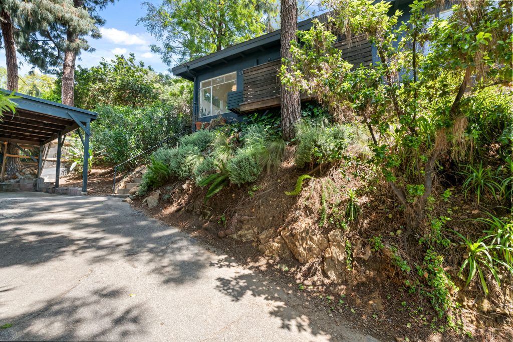 Hollywood Dell Mid Century Treehouse discreetly perched up a private drive surrounded by gorgeous pine trees, citrus and lavender.