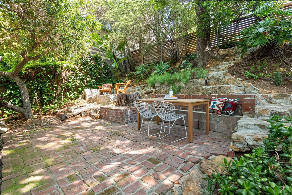 This outdoor space is exceptional for a quiet morning coffee under the canopy of mature trees or for larger gatherings of friends while looking out over the vibrant lights of the Hollywood skyline at night.