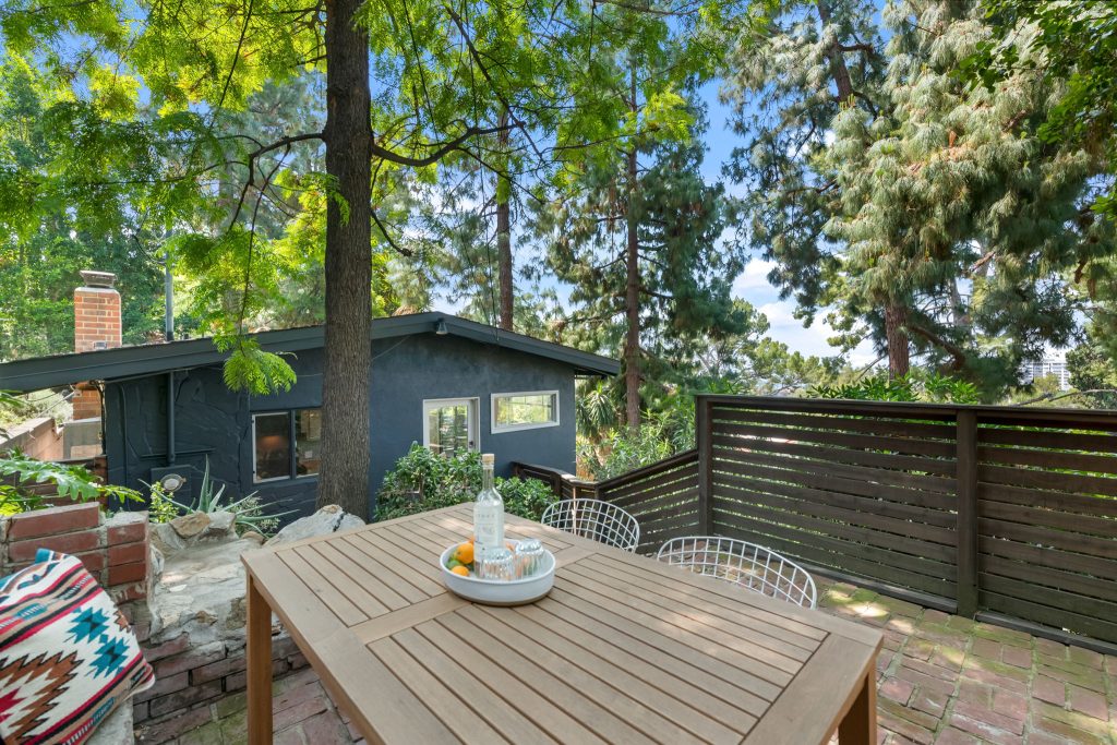 This outdoor space is exceptional for a quiet morning coffee under the canopy of mature trees or for larger gatherings of friends while looking out over the vibrant lights of the Hollywood skyline at night.