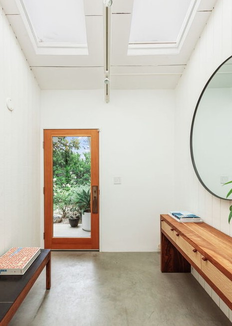 The primary bedroom, with high ceilings and casement glass sliders, is ensuite - with bathroom and walk-in closet - and has direct access to the pool.