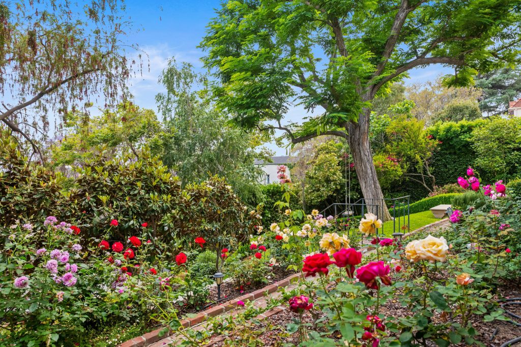 Rows of several varieties of rose bushes surround the property (some of which date back 100 years).