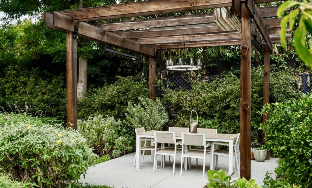 The back garden is lushly planted and the perfect entertaining space.