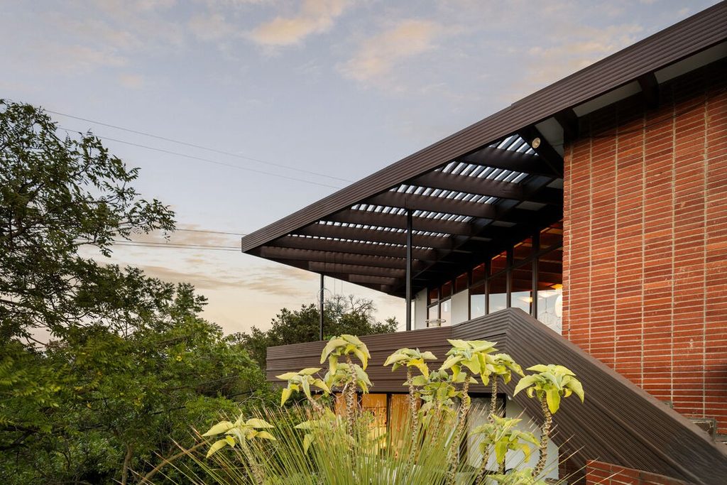 The Asher Residence circa by Case Study architect Rodney Walker. Large volume spaces with rows of glass windows set the tone for this mid-century post and beam in Sherman Oaks. Classic redwood finishes and flagstone flooring add to the romance of this custom built 1949 home.